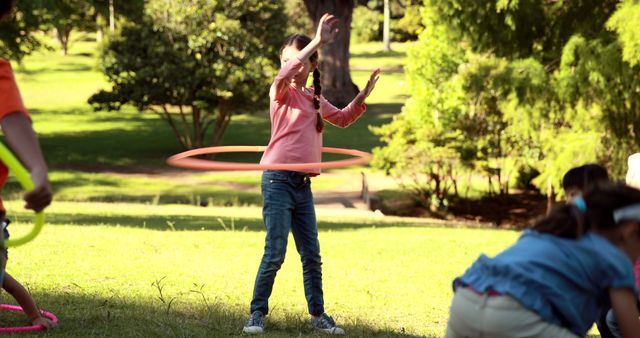 Child Playing with Hula Hoop in Sunny Park - Download Free Stock Images Pikwizard.com