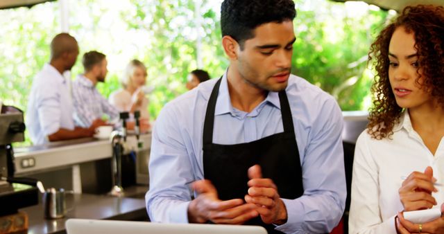 Male Barista Coaching Female Colleague in Coffee Shop - Download Free Stock Images Pikwizard.com