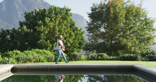 Middle-aged Woman Exercising Near Pool with Mountain View - Download Free Stock Images Pikwizard.com