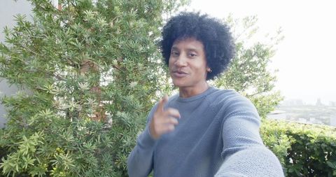 Afro Hairstyle Man Taking Selfie Overlooking Cityscape Outdoors