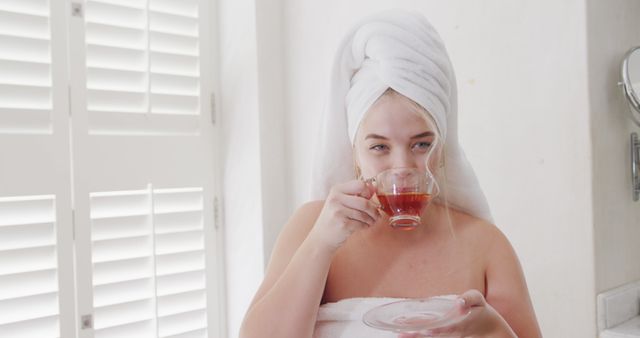 Relaxed Woman Enjoying Tea After Shower in Bathroom - Download Free Stock Images Pikwizard.com