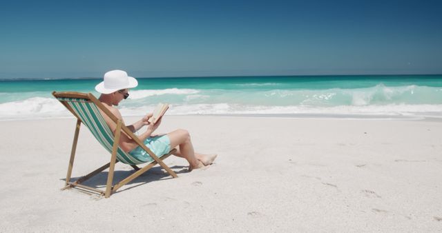 Man Relaxing on Tropical Beach Reading Book - Download Free Stock Images Pikwizard.com