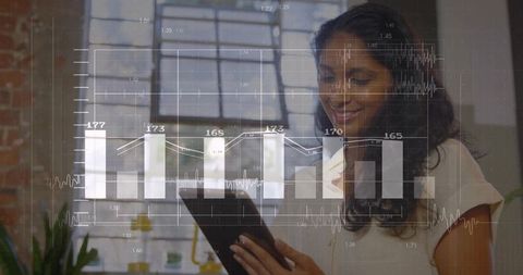 Woman Analyzing Digital Financial Data in Modern Loft Office