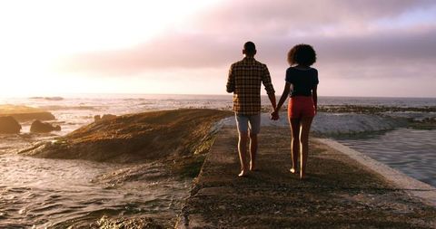 Couple Holding Hands Walking Beach Sunset Romance