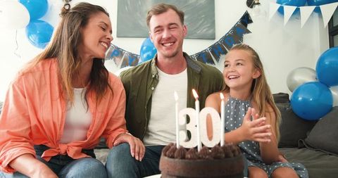 Joyful Family Celebrating Father's 30th Birthday with Cake