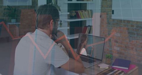 Man Engaged in Remote Video Call at Modern Home Workspace