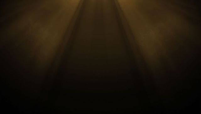 Warm golden spotlights illuminate dramatic theater stage