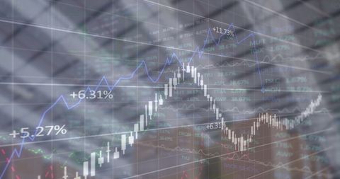 Financial Graphs Overlaying Warehouse Packages Symbolizing Economy