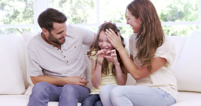 Happy Family Enjoying Quality Time on Couch - Download Free Stock Images Pikwizard.com