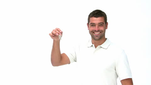 Smiling Man Holding Keys Against White Background