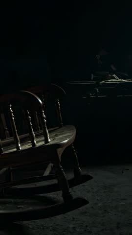 Quiet Rustic Workshop Showing Vintage Wooden Rocking Chair Remaining Still in Dim Light