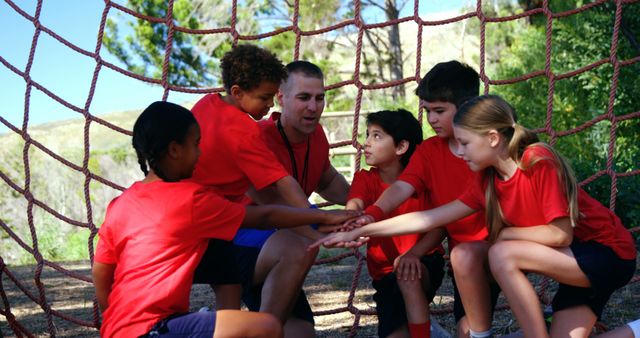 Children and Coach Motivational Team Huddle on Rope Climbing Net - Download Free Stock Images Pikwizard.com