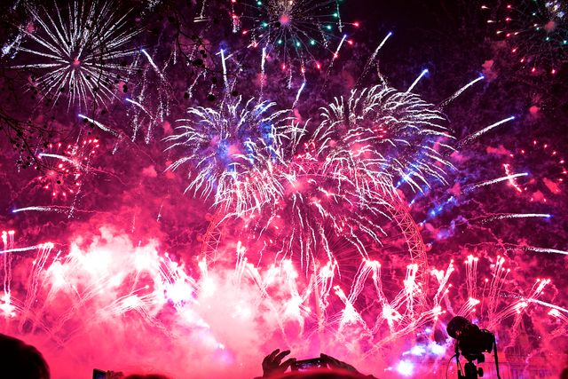 Image captures stunning colorful fireworks exploding against dark night sky during celebration. Perfect for illustrating New Year's Eve, Independence Day, festivals, parties, or any celebratory occasions. Ideal for event announcements, posters, social media posts, or festive website banners.