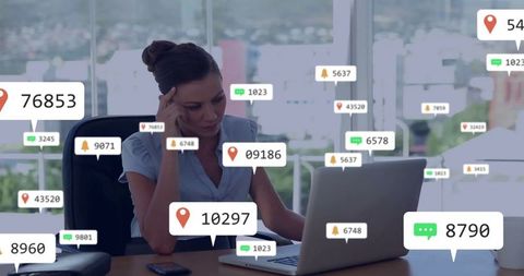 Businesswoman analyzing social media metrics at office desk