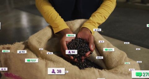Worker holding coffee beans with floating social media icons