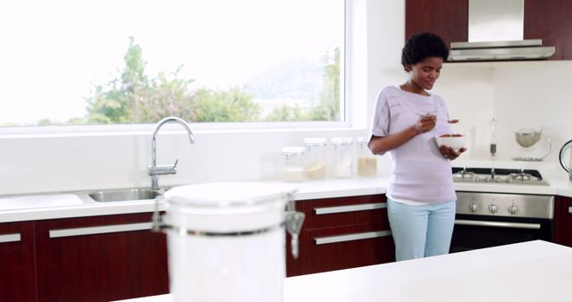 Pregnant woman eating healthy meal in modern kitchen high key lighting - Download Free Stock Images Pikwizard.com