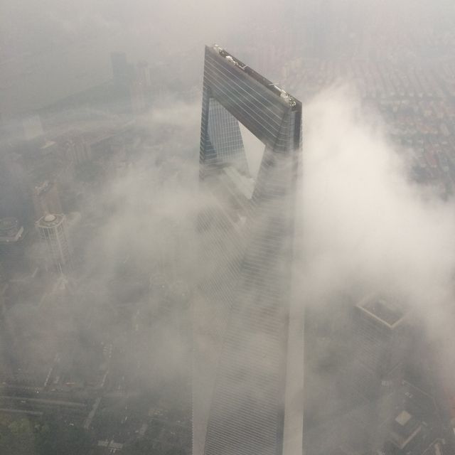 Shanghai Tower in Clouds on Foggy Day Aerial View - Download Free Stock Photos Pikwizard.com