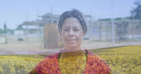 Senior Woman on Picturesque Farm with Yellow Flowers