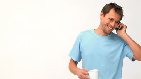 Man Relaxing with Coffee During Phone Call on Break