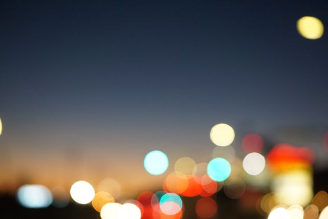 Vibrant Bokeh Lights Against Blurred Background in Evening - Download Free Stock Photos Pikwizard.com