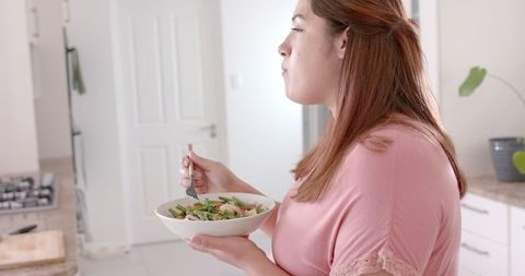 Healthy Eating Habits of Biracial Woman Enjoying Salad