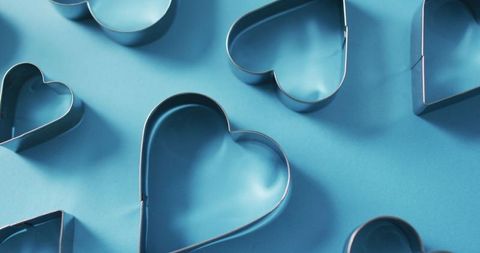 Heart Cookie Cutters on Blue Background for Valentine's Day Crafting