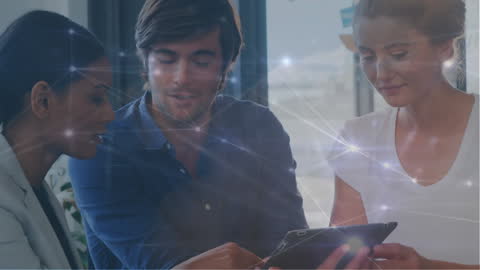 Diverse Business Team Discussing Digital Connections in Office