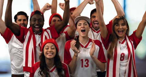 Excited Group of Sports Fans in Red and White Celebrating Victory - Download Free Stock Images Pikwizard.com