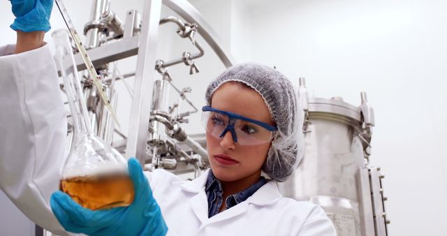 Focused Scientist Analyzing Liquid Sample in Laboratory - Download Free Stock Images Pikwizard.com