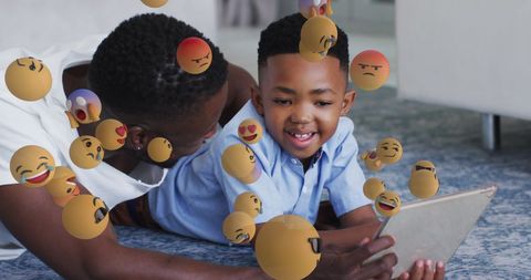 Father and son bonding with digital technology and emoticons