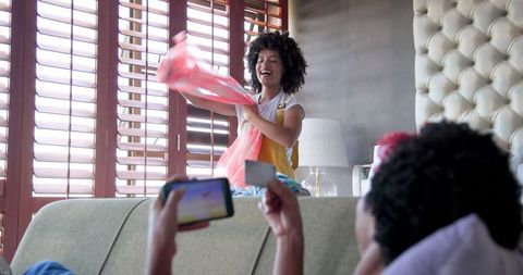 Relaxed Domestic Scene with Woman Using Smartphone
