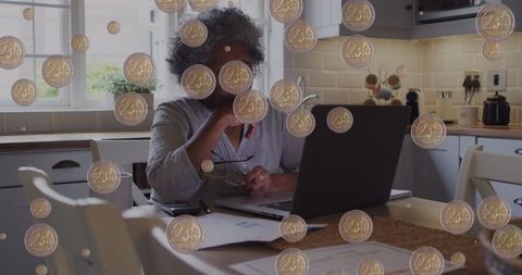 Senior woman managing finances with coin overlay