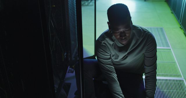 Technician Working in Server Room at Night - Download Free Stock Images Pikwizard.com