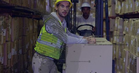 Warehouse Worker Inspecting Boxes with Forklift in Aisle