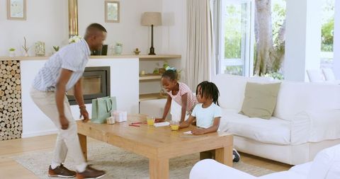 Family Time in Cozy Living Room with Art and Play