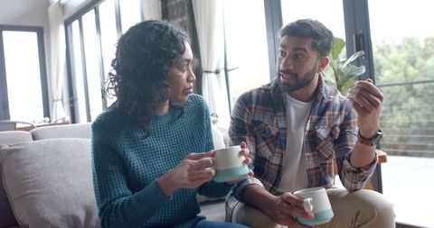 Happy Couple Drinking Coffee Together at Home
