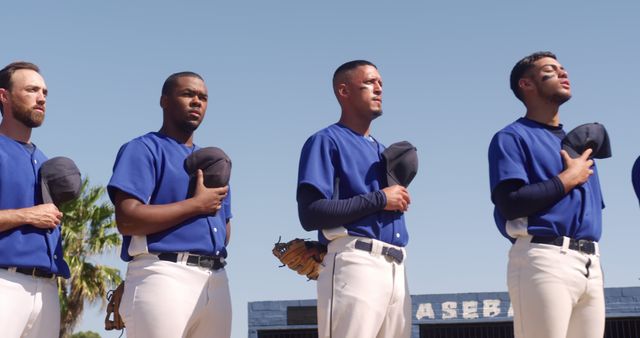 Baseball players standing with hats over hearts before game - Download Free Stock Images Pikwizard.com