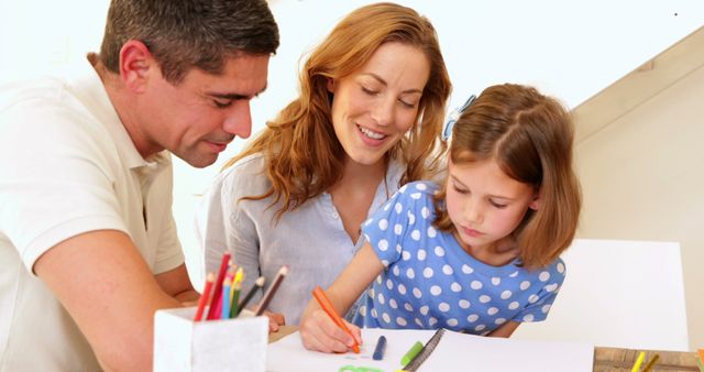 Parents are helping their young daughter with her homework at home. The scene depicts family support and educational activities. Mother's and father's involvement demonstrate the significance of active participation in a child's learning process. Useful for illustrating family dynamics, educational materials, parenting articles, or advertisements focusing on family-friendly products.
