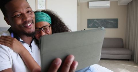 Joyful Couple Sharing Pregnancy News via Video Call