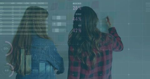 Professionals Analyzing Data on Glass Wall with Digital Graphics Overlay