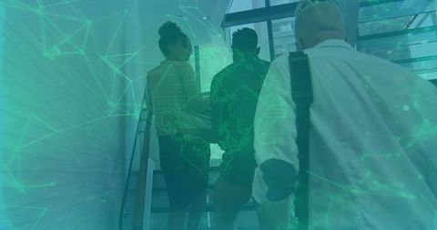 Team of professionals ascending office staircase with green technology overlay