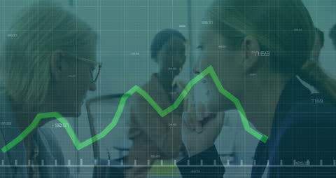 Colleagues Whispering Amid Financial Data Visualization