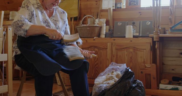 Senior Woman Carding Wool in Rustic Workshop - Download Free Stock Images Pikwizard.com