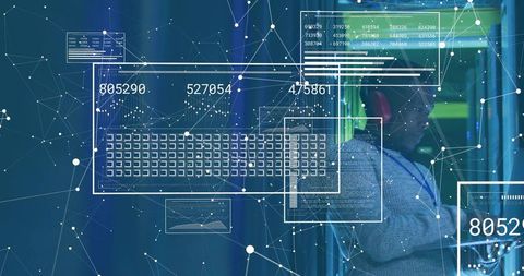 Data center technician monitoring servers with holographic network visualization