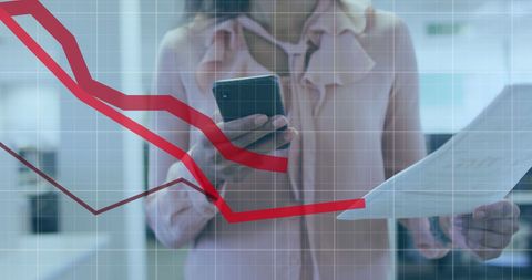 Businesswoman Analyzing Financial Data on Mobile Device