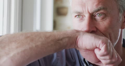 Pensive Man Looking Outside Arm Resting on Chin