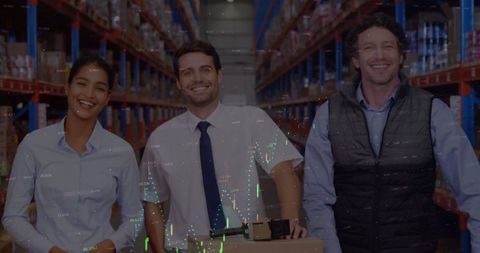 Smiling warehouse team with digital financial overlay