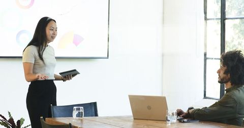 Diverse Team Engaged in Business Presentation in Modern Office