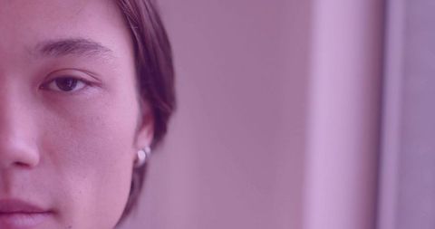 Minimalist Portrait of Man with Hoop Earring in Pastel Tones