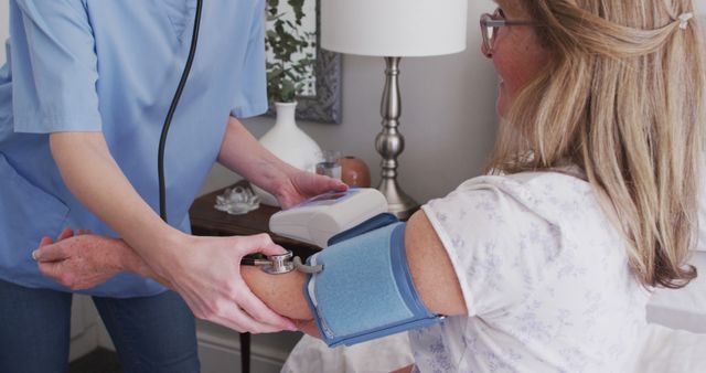 Home Healthcare Worker Measuring Senior Patient's Blood Pressure - Download Free Stock Images Pikwizard.com